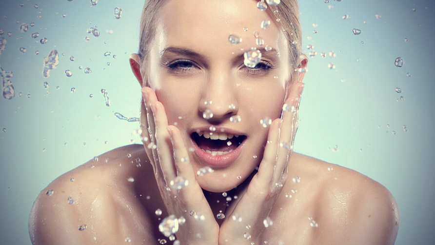 young-and-beautiful-woman-washing-her-face